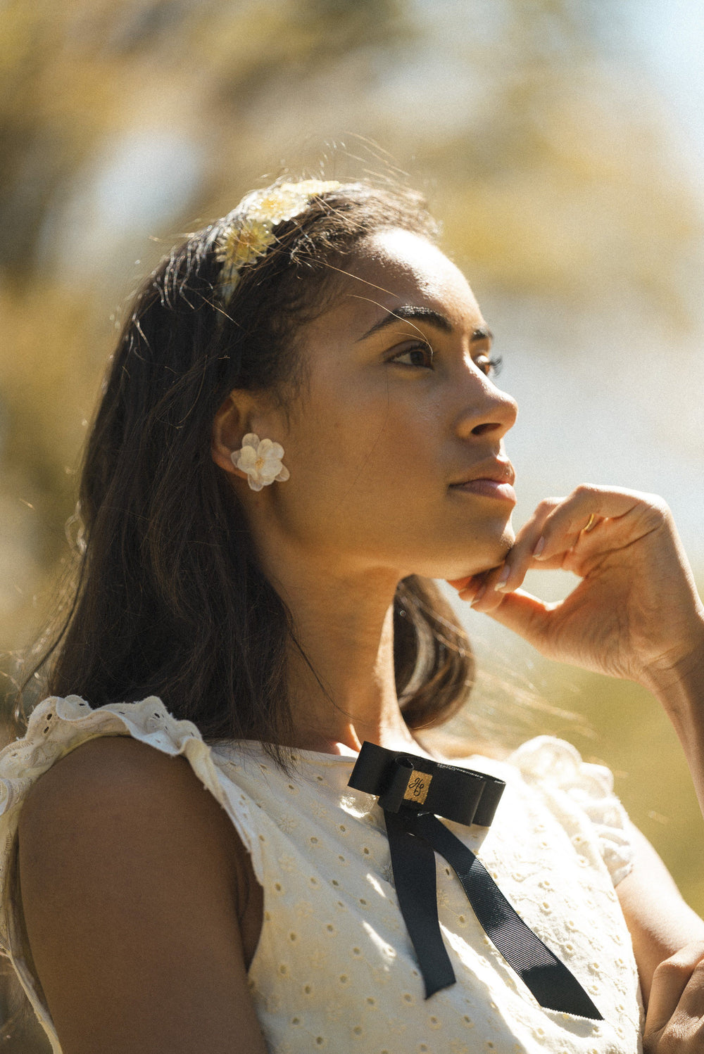 Lemon broderie anglaise mini reversible dress with a detachable black bow Dress Hannah Sophia England 