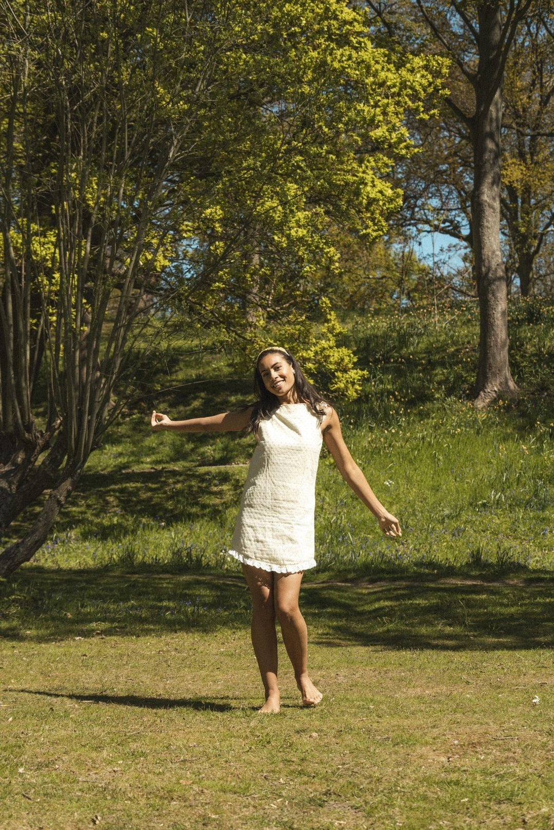 Lemon broderie anglaise mini reversible dress with a detachable black bow Dress Hannah Sophia England 