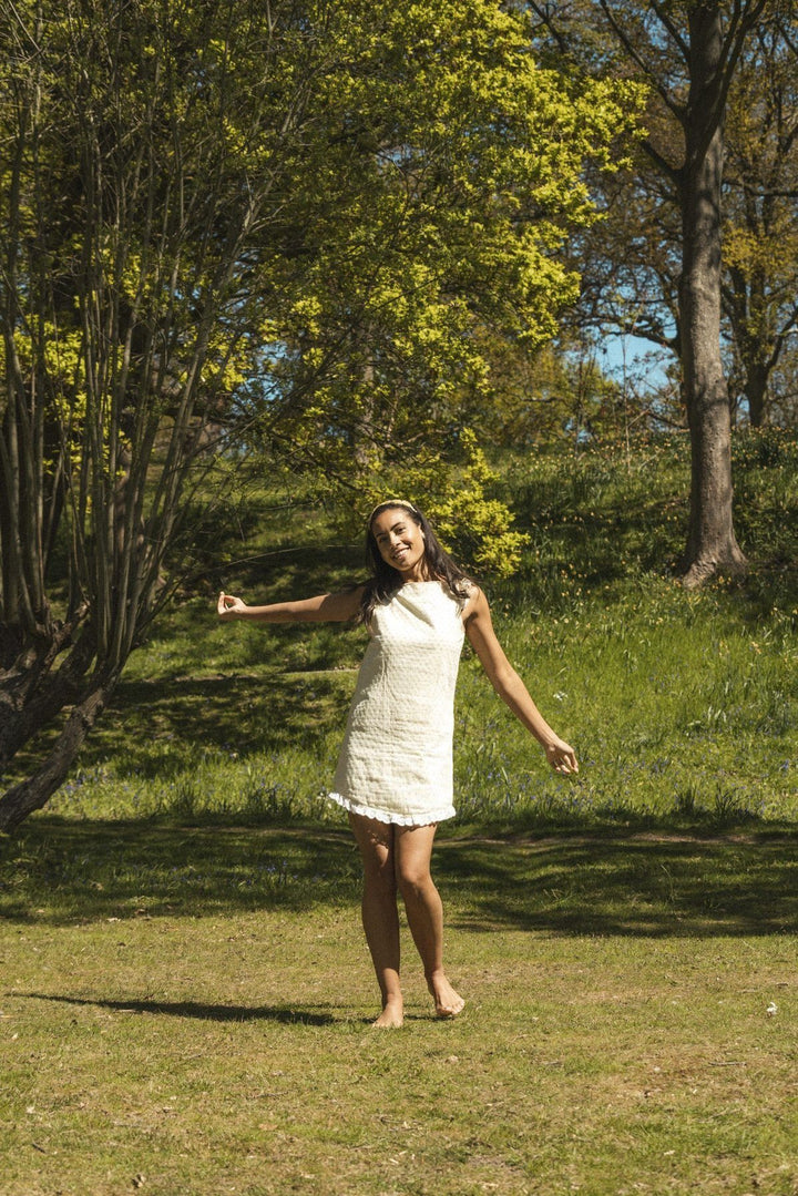 Lemon broderie anglaise mini reversible dress with a detachable black bow Dress Hannah Sophia England 